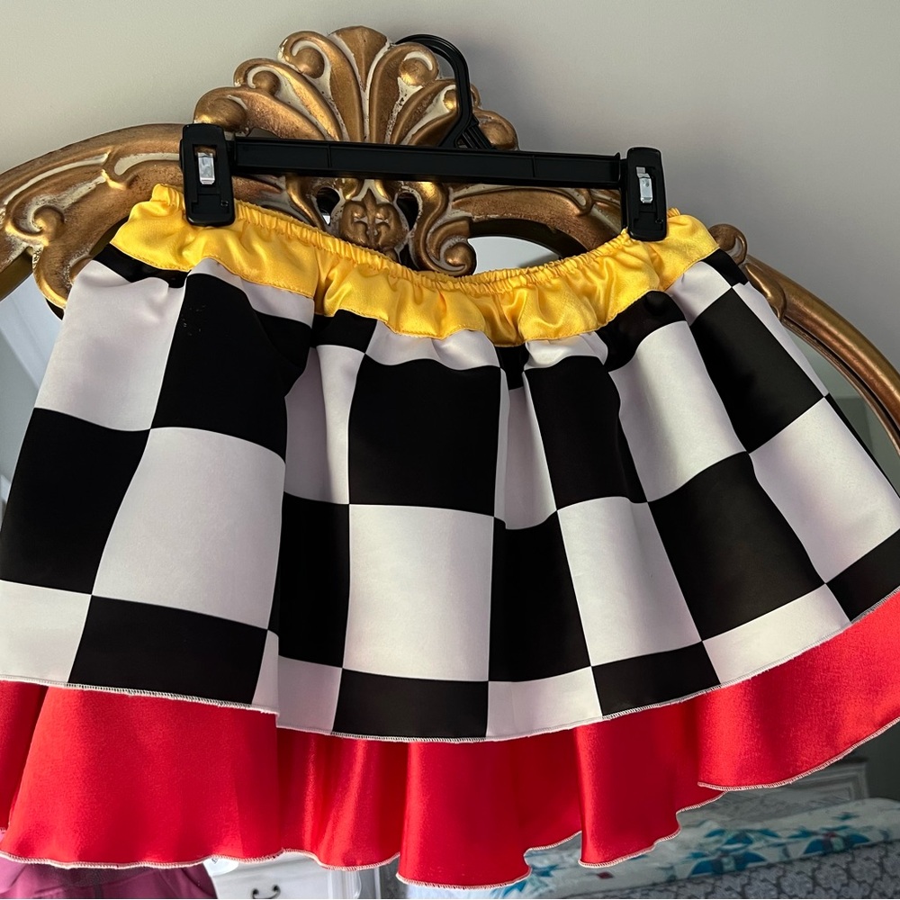 Red, yellow, black and white checkered skirt